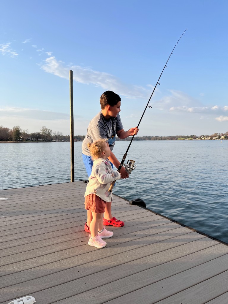 Carter and Collins Brantley fishing together on a dock